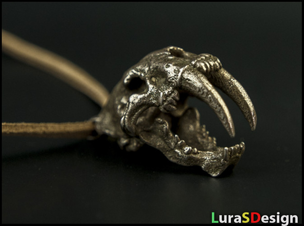 Skull of a saber-toothed Cat in Polished Bronzed Silver Steel