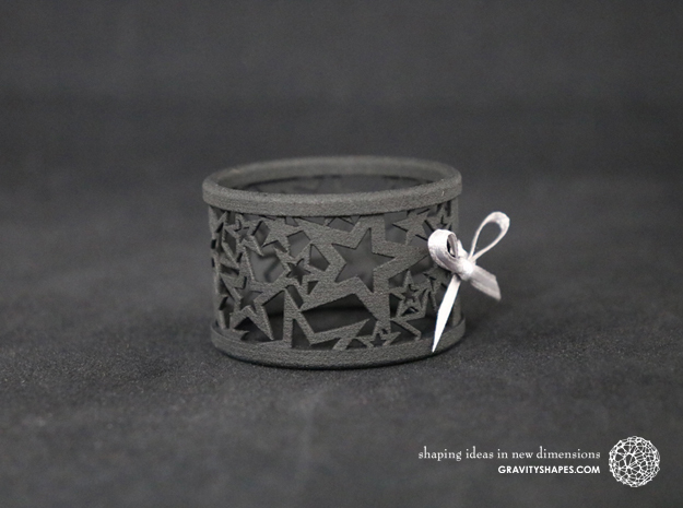 A large Christmas napkin ring with Stars in Black Natural Versatile Plastic