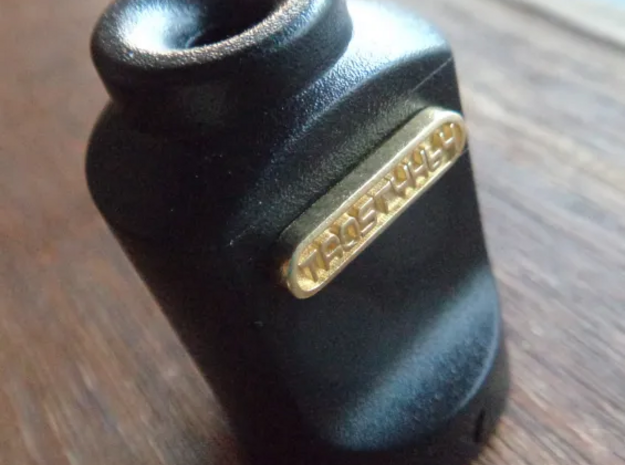 TaoStyx64 Controller Plug Cap Emblem in Polished Brass