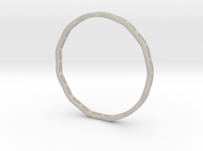 Bracelet 3D printed in Sandstone: Delicate and grainy, with a coarse finish and sand-like color.