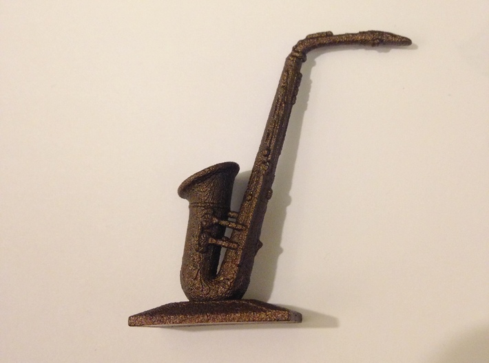 Alto Saxophone (Metals) 3d printed Polished bronze steel saxophone against a white background.