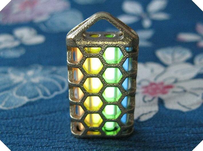 Hex Lantern X4: Tritium (All Materials) 3d printed In this picture the phosphorus coating on the tritium vial is being energised by UV light.