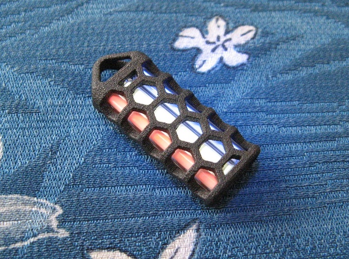 Hex Lantern X3: Tritium (All Materials) 3d printed In this picture the phosphorus coating on the tritium vial being energised by UV light.