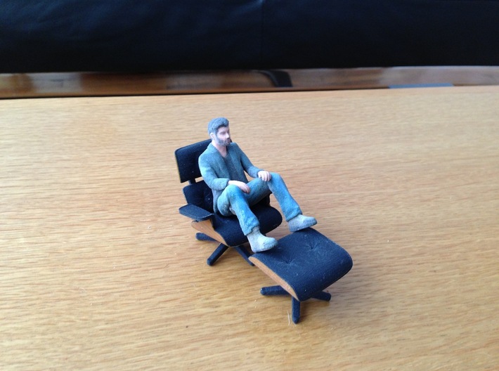 An Itty Bitty Sad Keanu 3d printed Sad Keanu lounging in KSpence's 3d printed Eames Chair
