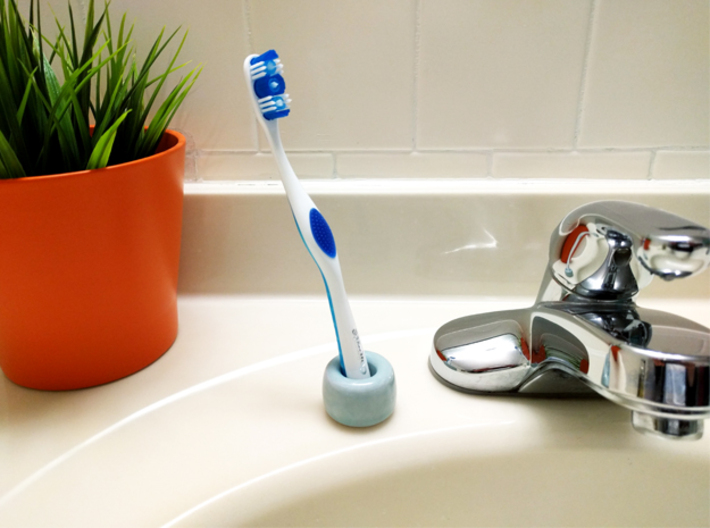 Personal Toothbrush Holder 3d printed The Personal Toothbrush Holder's small size takes up almost no counter top space in the bathroom.
