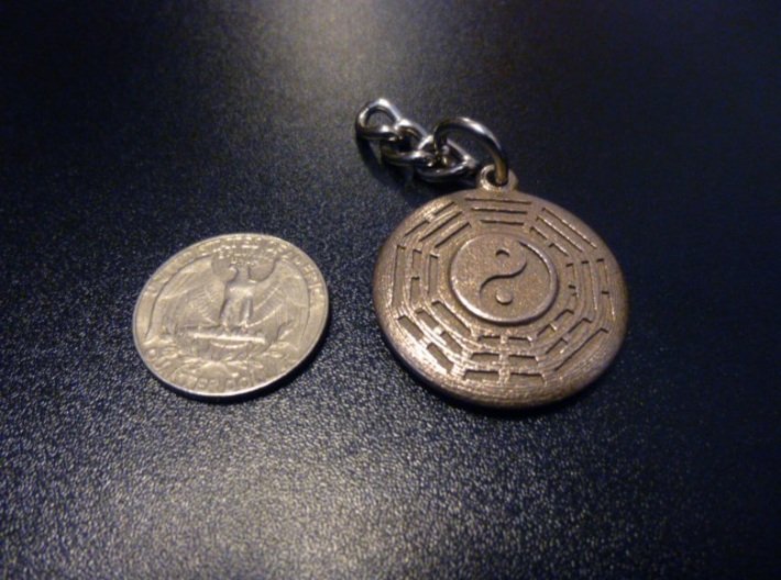 Yin Yang Keychain with Fuxi Bagua 3d printed Stainless Steel keychain next to a standard US quarter