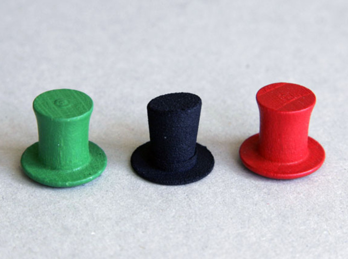 Top Hat Boardgame Counters (x4) 3d printed Showing size compared with the 'Last Will' top hats (the red and green ones).