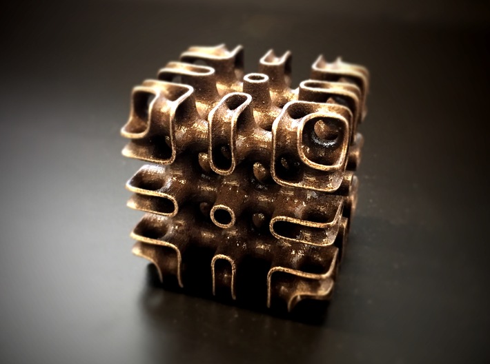 Minimal-Surface Array 3d printed Photo of the Array printed in Bronzed Steel