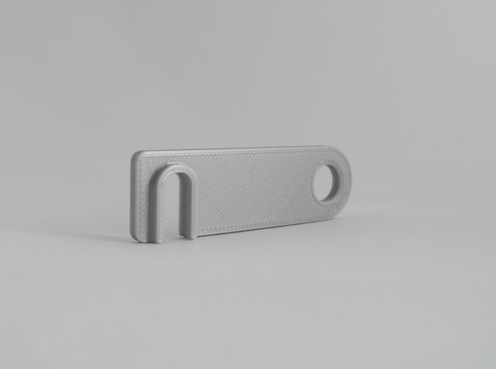 iPhone landscape stand keychain 3d printed * Material with a similar look to polished metallic but printed on an Ultimaker 2+. The model offered for sale doesn't have the flat on the bottom as seen in this model.