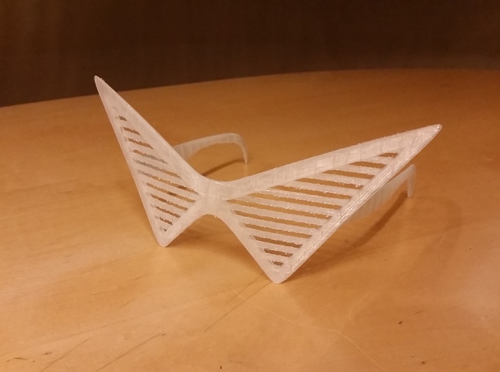 Triangle Glasses 3d printed 3D printed with PLA and supports. (Self Cleaned which is why it may look a little sharp in some places)