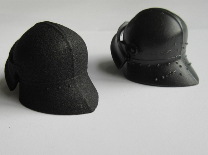 Medieval Sallet compatible with playmobil figure 3d printed Left: Black Strong & Flexible plastic. Right: Black High Definition Acrylate before sanding, with all the support marks.