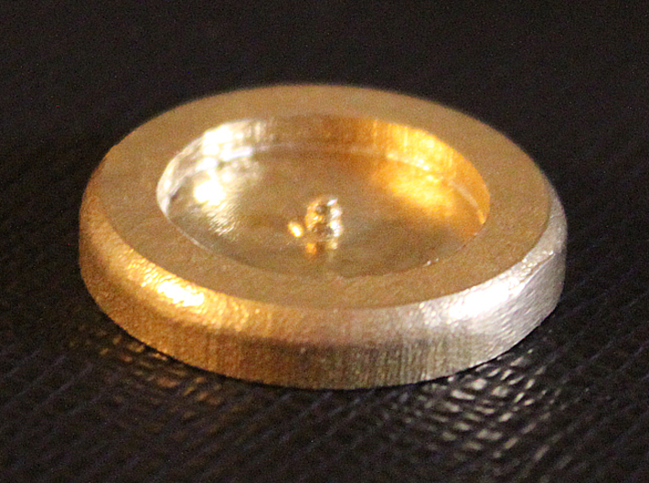 Montucio Wax Seal Stamp 3d printed a view of the raw brass print from the "top"  I wasn't sure how well the little screw on my model would work, turns out it works well enough although I do need to use some glue to secure it tightly to the handle.
