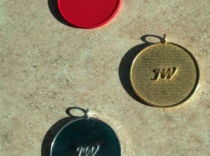 Navajo Water Sign Medallion  3d printed Pure silver (bottom), gold plated steel (center), red nylon (top)
