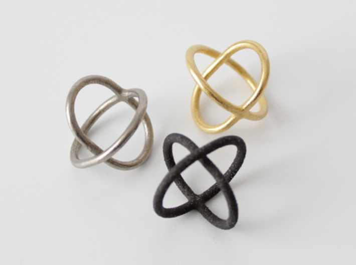 Satellite Ring  3d printed Shown in polished gold steel, matte black steel and stainless steel