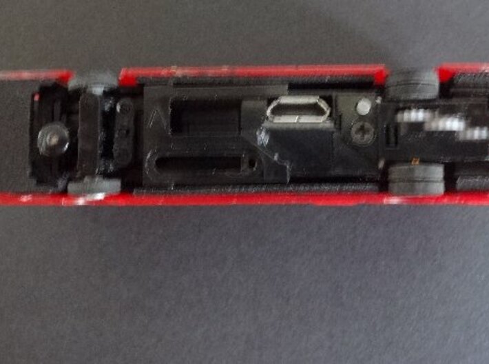 Interface for Tomytec chassis with New Routemaster 3d printed Underside of chassis in interface in a bus