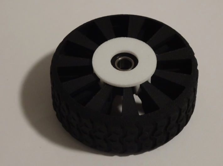 Bearing Capture Bracket for 2 Inch Airless Tire 3d printed SHOWN WITH PRINTABLE "2 INCH FUTURISTIC TIRE" AND BEARING