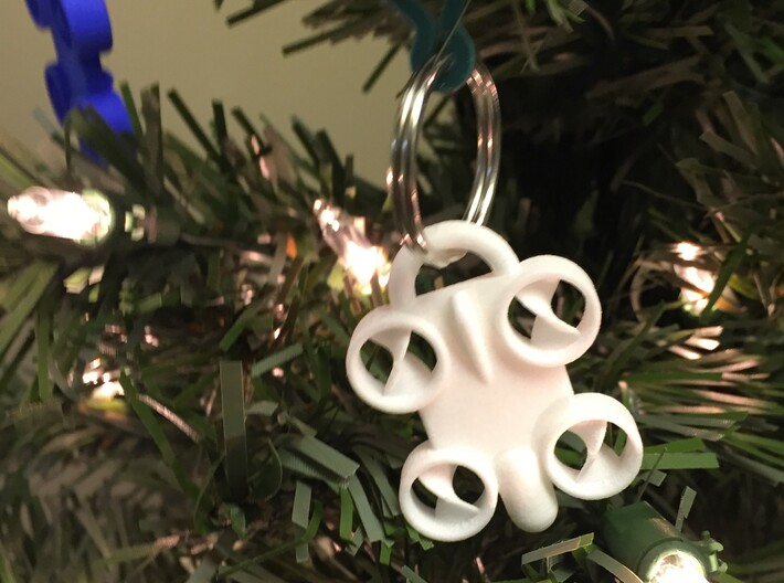 Minature Drone Ornament 3d printed White Keychain shown being used as a Christmas tree ornament. Key ring not included with purchase.