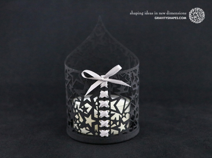 Christmas tealight holder with stars 3d printed The photo shows a print made of black strong and flexible incl. silver lacing.