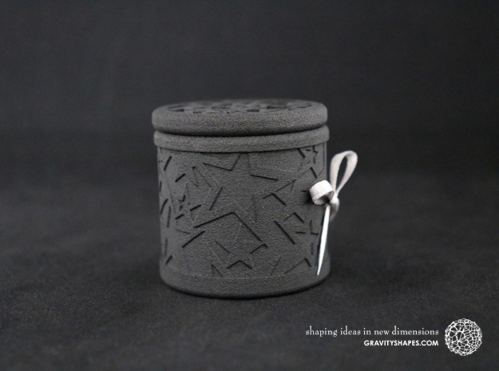Gift Box No. 1 with Stars (solid, high) 3d printed The photo shows a print made of black strong and flexible incl. silver lacing.