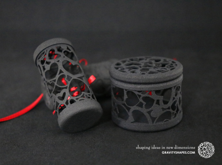 Filigree Gift roll small with Hearts (6 cm) 3d printed The photo shows prints made of black strong and flexible incl. red lacing.