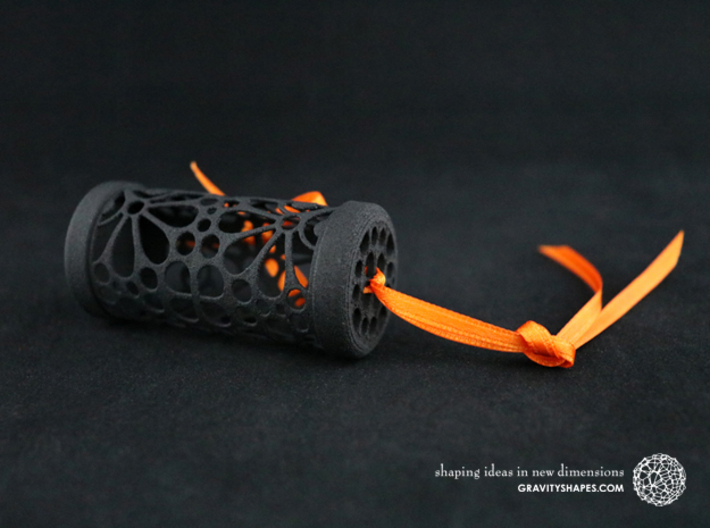 Filigree Gift roll small with Mosaic-3 (6 cm) 3d printed The photo shows a print made of black strong and flexible incl. orange lacing.