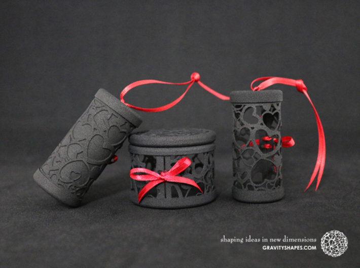 Solid Gift roll small with Hearts (6 cm) 3d printed The photo shows prints made of black strong and flexible incl. red lacing.