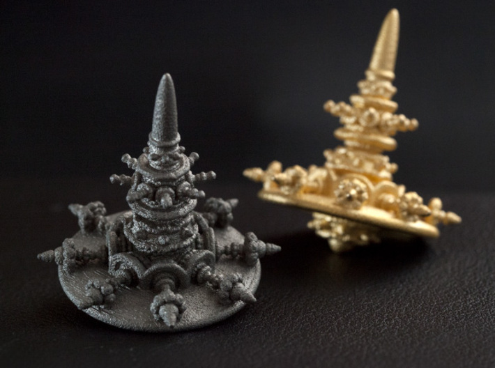 Spinning Top of Escaped Times 3d printed From left to right, Stainless Steel and Gold plated Polished Stainless Steel.