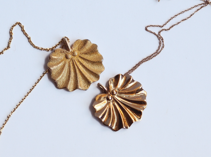 Seashell Fan Pendant 3d printed Polished Gold Steel Left, Polished Bronze Right