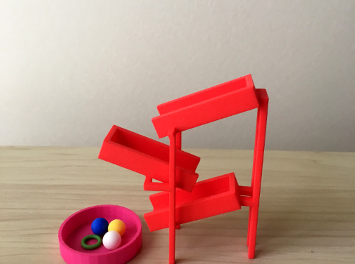 Torus for the toy slides 3d printed The combination of the toy slide, container, and balls. 