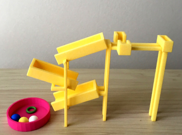 Torus for the toy slides 3d printed The combination of the toy slide, container, and balls. 