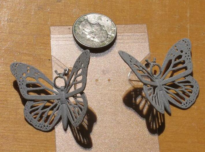 Monarch Earrings 3d printed Printed in Polished Aluminide with earring hooks included.