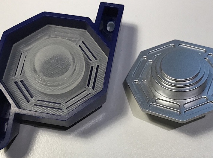 Artoo De Ago's 1:2.3 octagon ports, shallow ANH 3d printed Left: unpainted and unsanded 3D print inside the blue De Ago holder. Right: silver De Ago octagon