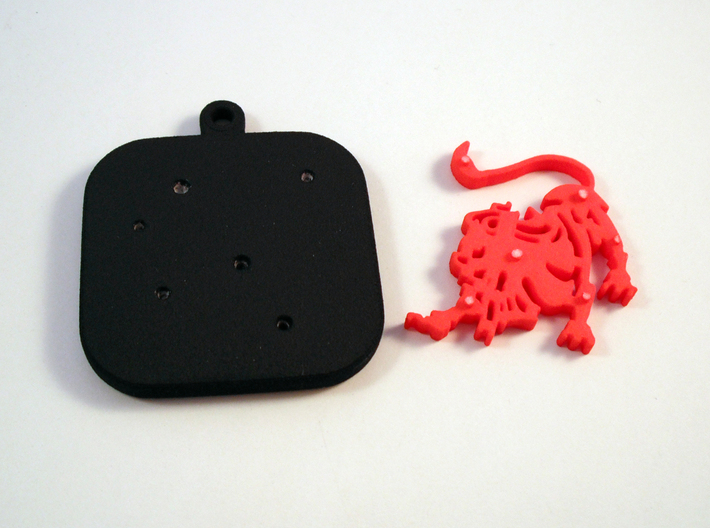 Base for "Keychain Zodiac Lion" (two color) 3d printed Base and Lion printed in black and red polished plastic.