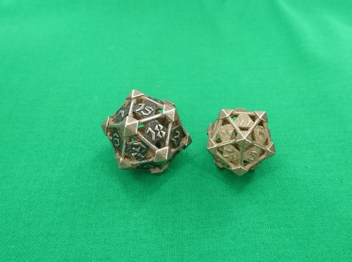 Prism D20 3d printed Prism D20 Large in polished bronze silver steel painted to raise contrast (left) and medium unpainted.