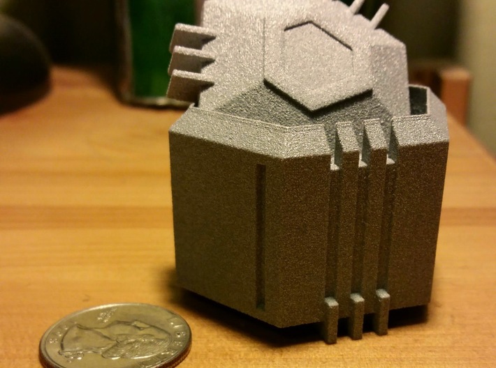 Ingress Inspired Capsule 3d printed Printed in Metallic Plastic. Quarter for scale.