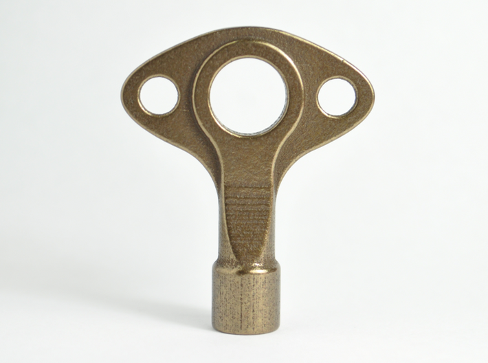Drum Key - Wearable &amp; Functional by SCAD Design 3d printed Physical Sample of Polished Bronze