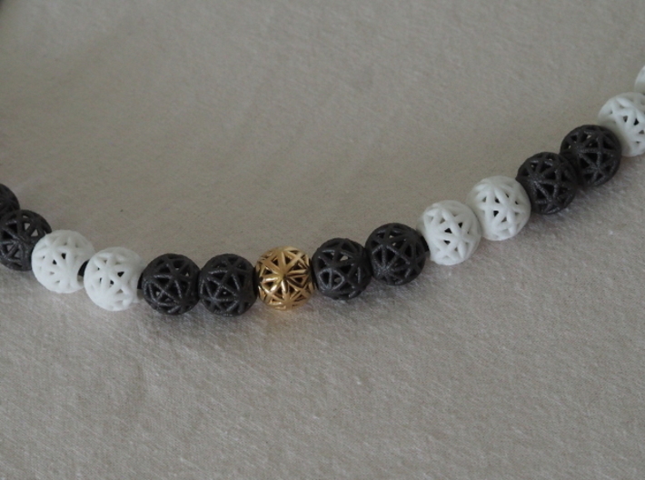 torus_pearl_type4_thick 3d printed Dark Gray PA12 Glass Beads, White Natural Versatile Plastic and Polished Brass