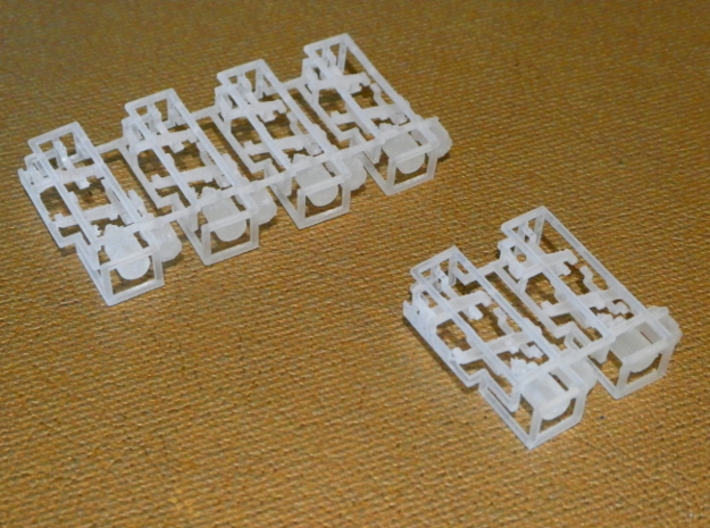 HO KD (Split K Brake) Air Brake System Kit 3d printed This image shows how our KD brake systems look when delivered.  In front is the "small" size with two sprues; in back is the "large" size with four sprues.