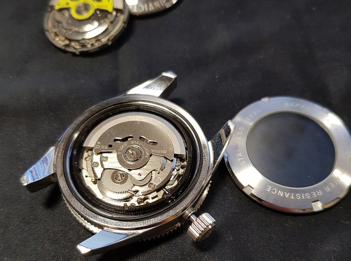 Seiko movement adapter for 41mm watch cases 3d printed Picture taken featuring a black plastic prototype.