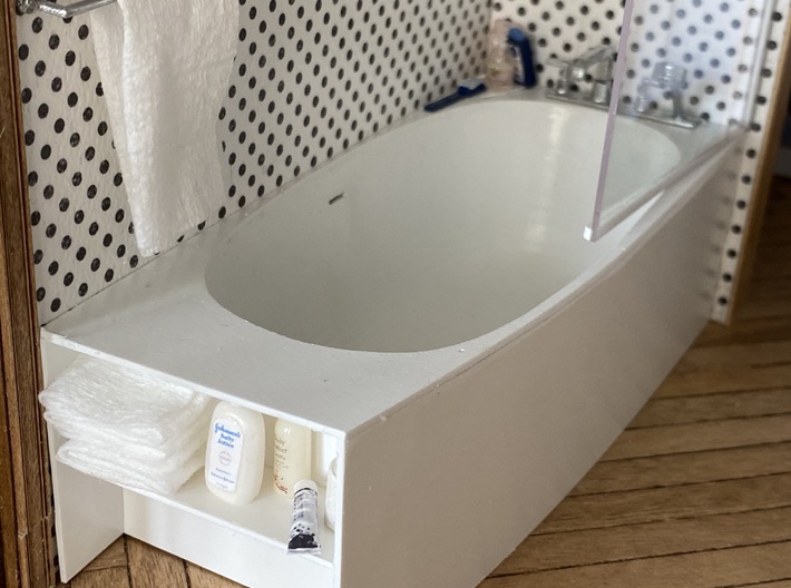 Freestanding bathtub with tap, 1:12 3d printed 1:12 The tub  is integrated into a polystryrol casing I made