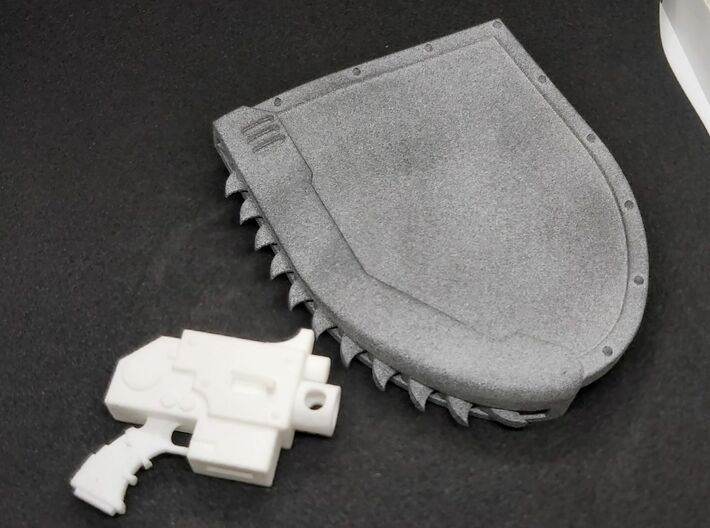 Action Figure Chainshield - Right handed 3d printed Left handed version, printed in Grey PA12, compared to Action Figure Bolt Pistol