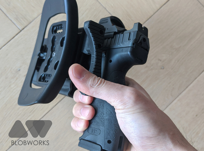 [Holster] BlackHawk Omnivore Release Extension  3d printed If initial thumb placement is incorrect, there's still a high chance of the button being hit. 