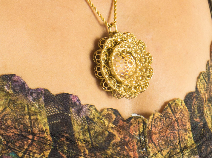 Geo Lotus (2014 version) 3d printed photo of pendant in natural brass on a model