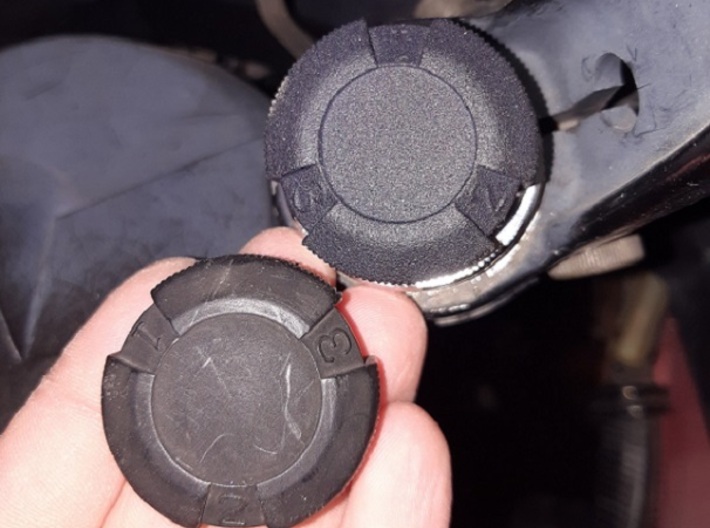 Right hand fork cap for VF750F 3d printed 3D printed part (on the bike) vs original part (in the hand)