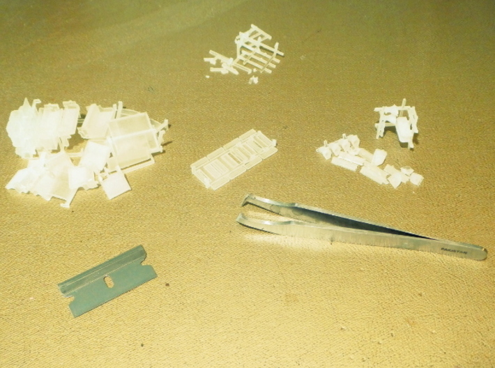 HO Pullman DR/C Furniture Pack, Ionic Style 3d printed Try to separate each part before removing the smaller sprue chunks.  Note the array of radiators found in the middle.
