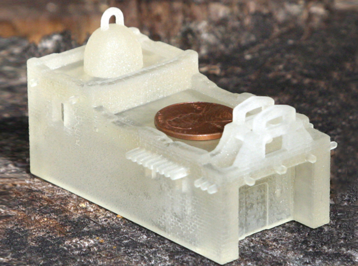 Z Scale Adobe Mission 3d printed FUD print from the front with a penny for scale.