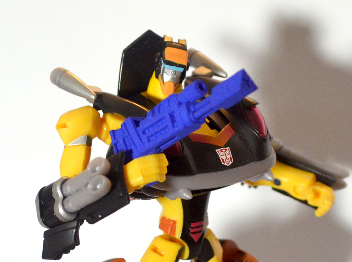 Autobot Jackpot's Heat Induced Photon Rifle 3d printed Print shown with Jackpot action figure.