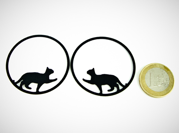 Give Me Some Food Cat Hoop Earrings 40mm 3d printed Give Me Some Food Cat Hoop Earrings 40mm printed in Black Strong & Flexible with 1€ coin for scale.