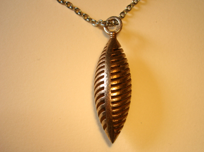Elliptical Slotted Pendant 3d printed Photo of an actual pendant. Chain not included.