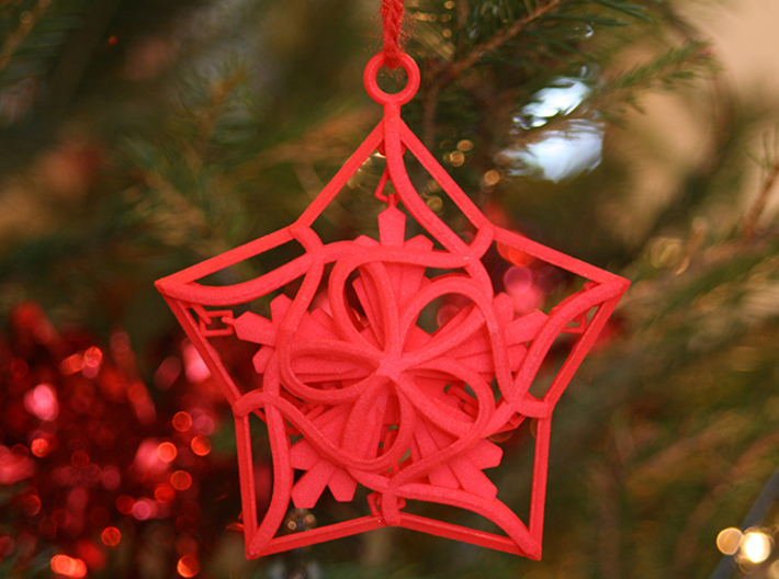 Captured Snowflake - Christmas Ornament 3d printed Shown in the 'Coral Red Strong and Flexible Polished' material